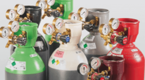 Several differently coloured gas bottles