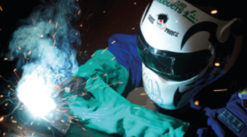 A person welding some metal